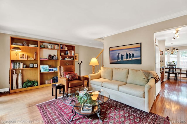 1874 Wickham St Unit 68, Royal Oak, MI 48073 - living room featuring a chandelier, ornamental molding, and hardwood / wood-style floors