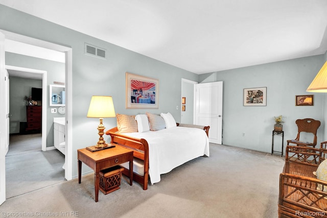 1874 Wickham St Unit 68, Royal Oak, MI 48073 - bedroom with light carpet, baseboards, and ensuite bathroom