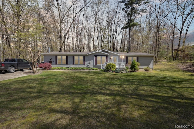 4952 Davison Rd, Lapeer, MI 48446 - view of front of house with a front lawn and a porch