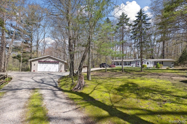 4952 Davison Rd, Lapeer, MI 48446 - view of green lawn with an outdoor structure, a garage, and driveway