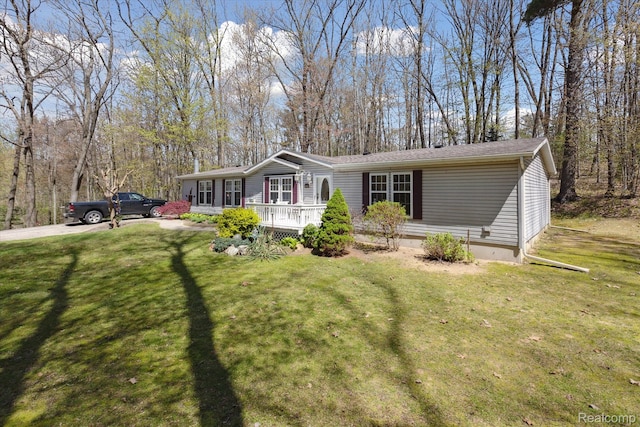 4952 Davison Rd, Lapeer, MI 48446 - manufactured / mobile home with covered porch and a front yard