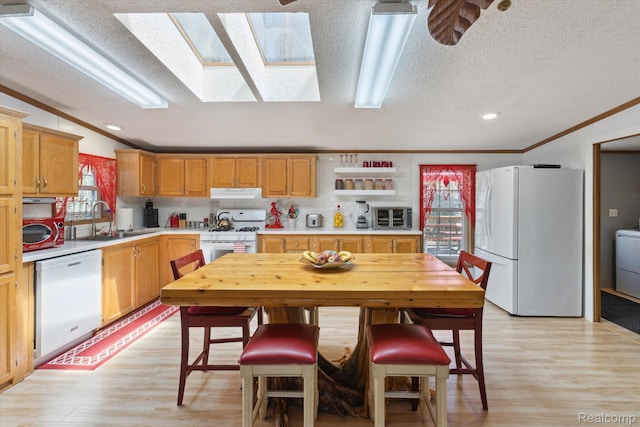 4952 Davison Rd, Lapeer, MI 48446 - kitchen with white appliances, a textured ceiling, a sink, light countertops, and crown molding