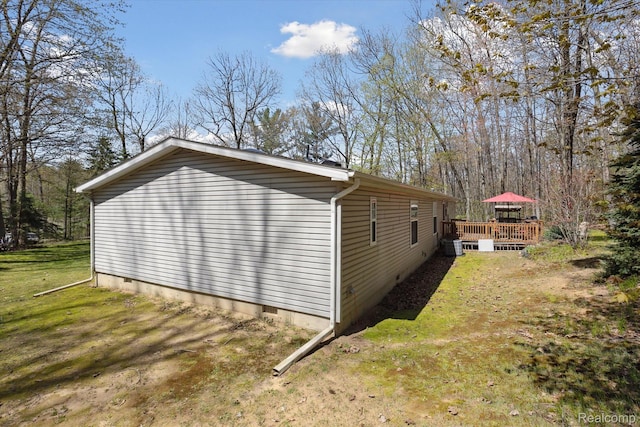 4952 Davison Rd, Lapeer, MI 48446 - view of side of home with crawl space, a deck, a yard, and central AC unit