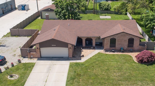 3244 Dearborn St, Wayne, MI 48184 - view of front facade featuring brick siding, an attached garage, a shingled roof, and concrete driveway