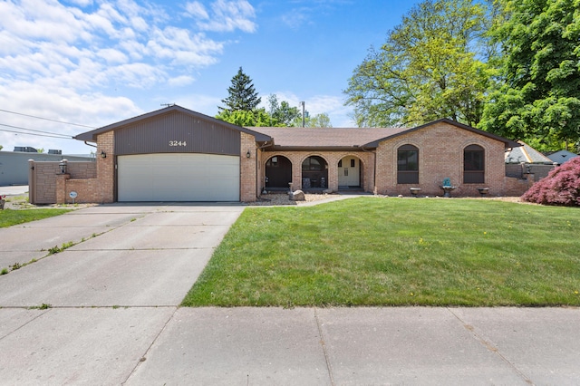 3244 Dearborn St, Wayne, MI 48184 - ranch-style home with brick siding, an attached garage, a front lawn, and driveway
