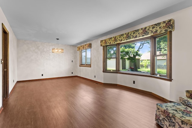 3244 Dearborn St, Wayne, MI 48184 - unfurnished living room with wood finished floors and baseboards