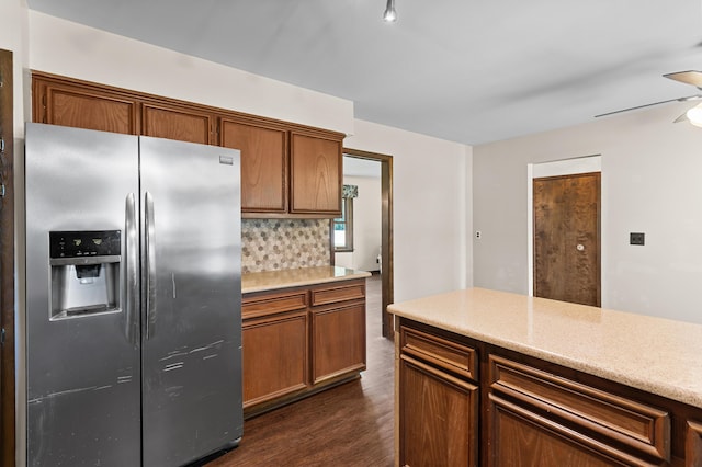 3244 Dearborn St, Wayne, MI 48184 - kitchen with stainless steel fridge with ice dispenser, decorative backsplash, light countertops, dark wood finished floors, and brown cabinetry