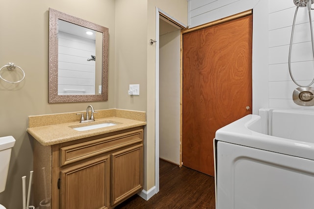 3244 Dearborn St, Wayne, MI 48184 - bathroom with vanity, wood finished floors, toilet, and bathing tub / shower combination