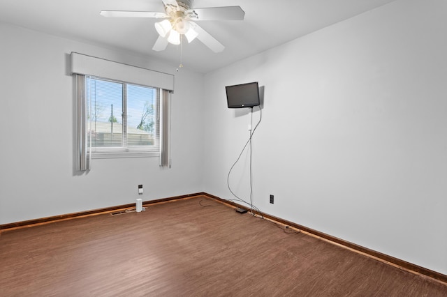 3244 Dearborn St, Wayne, MI 48184 - empty room featuring wood finished floors, baseboards, and a ceiling fan