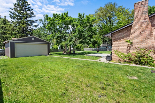 3244 Dearborn St, Wayne, MI 48184 - view of yard featuring a garage and an outdoor structure