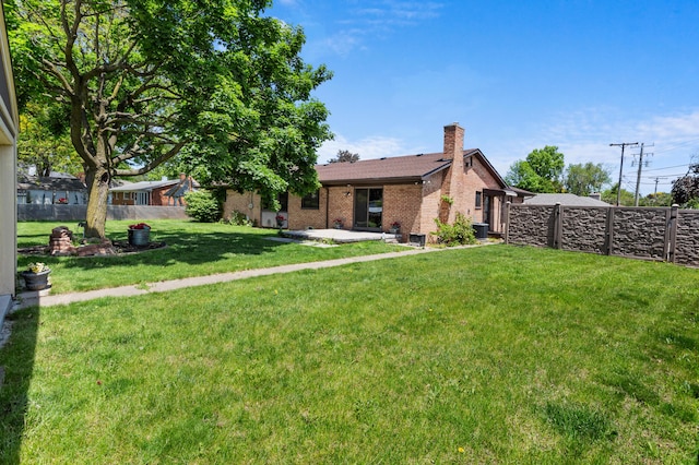 3244 Dearborn St, Wayne, MI 48184 - view of front of property featuring a chimney, a patio area, and brick siding