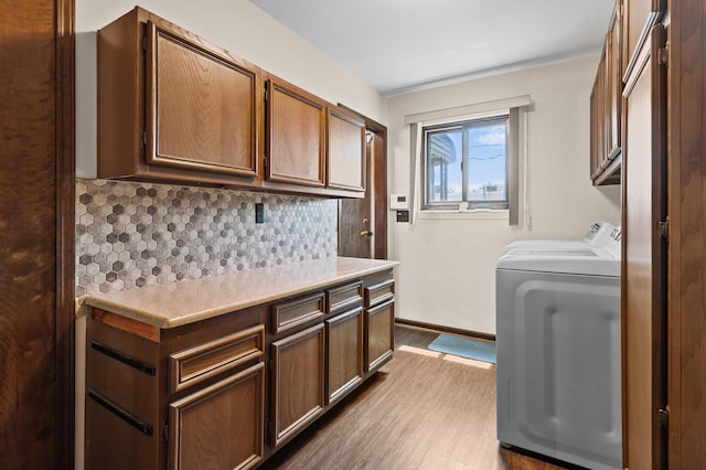 3244 Dearborn St, Wayne, MI 48184 - washroom featuring cabinet space, dark wood finished floors, washing machine and dryer, and baseboards
