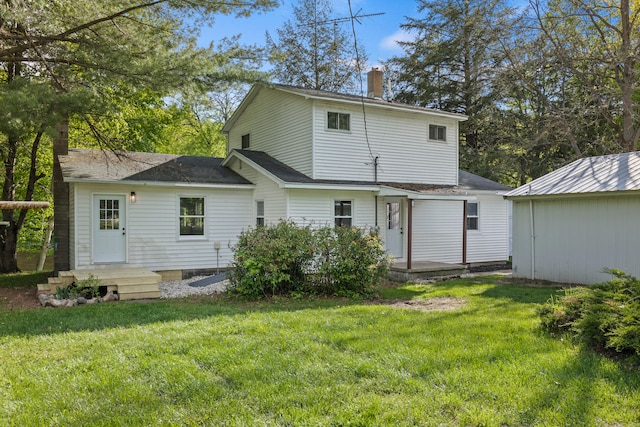 17465 Rapids Dr, Hersey, MI 49639 - rear view of house with a chimney, a lawn, and roof with shingles