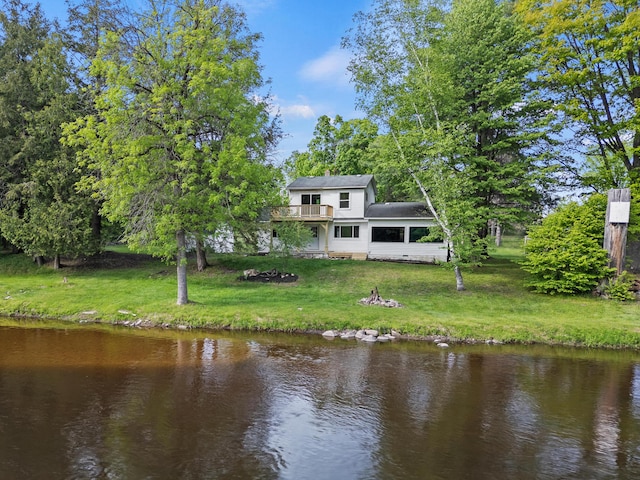 17465 Rapids Dr, Hersey, MI 49639 - rear view of house featuring a yard and a deck with water view