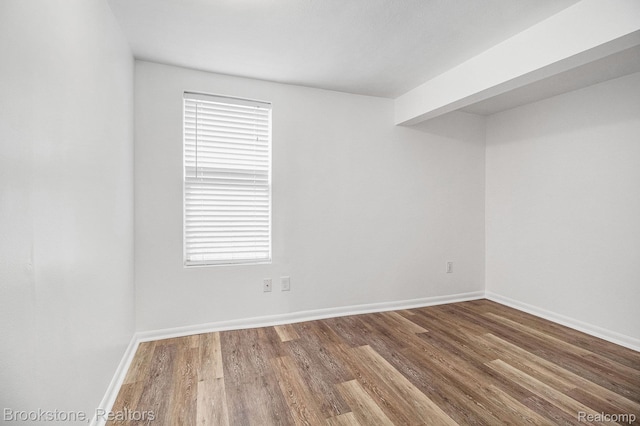 3012 Lansdowne Rd, Waterford, MI 48329 - spare room with wood finished floors and baseboards
