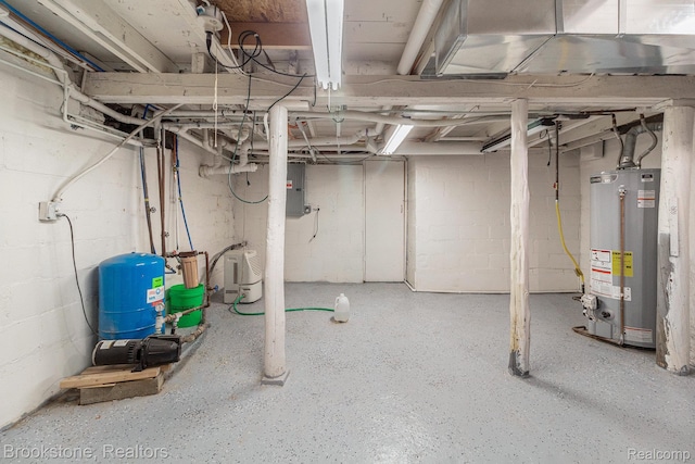 3012 Lansdowne Rd, Waterford, MI 48329 - unfinished basement featuring a water pressure tank, water heater, and electric panel