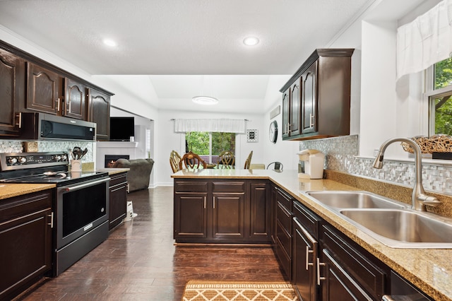 4085 Ravina Ter, Saint Joseph, MI 49085 - kitchen featuring stainless steel appliances, a sink, a peninsula, healthy amount of natural light, and recessed lighting