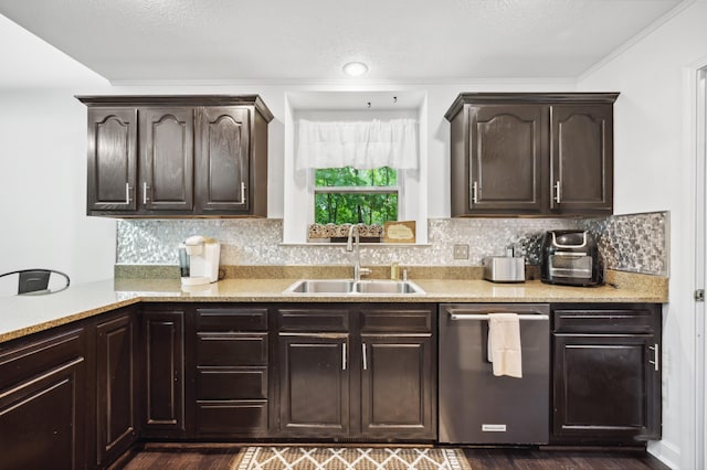 4085 Ravina Ter, Saint Joseph, MI 49085 - kitchen with stainless steel dishwasher, a sink, dark brown cabinetry, and light countertops