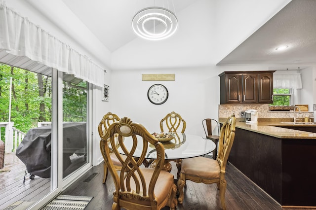 4085 Ravina Ter, Saint Joseph, MI 49085 - dining space featuring dark wood finished floors and vaulted ceiling