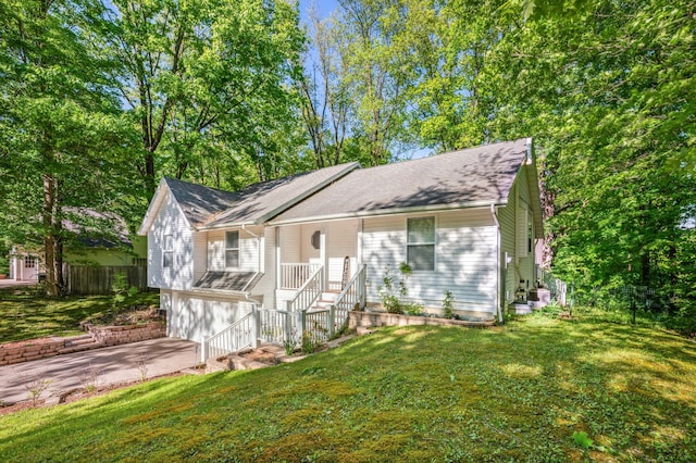 4085 Ravina Ter, Saint Joseph, MI 49085 - ranch-style home with a garage, concrete driveway, covered porch, and stairway