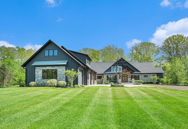 4035 136th Ave, Hamilton, MI 49419 - view of front of property with stone siding, board and batten siding, and a front lawn