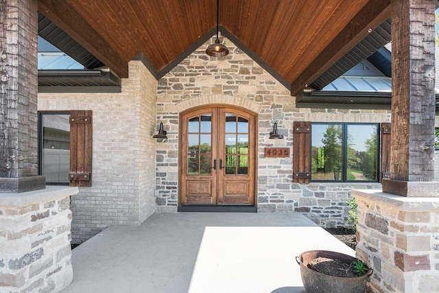 4035 136th Ave, Hamilton, MI 49419 - doorway to property with french doors and stone siding