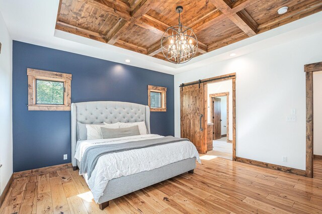 4035 136th Ave, Hamilton, MI 49419 - bedroom with wooden ceiling with exposed beams, a barn door, coffered ceiling, baseboards, and hardwood / wood-style flooring