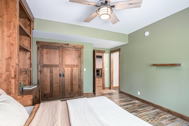4035 136th Ave, Hamilton, MI 49419 - bedroom with wood finished floors, baseboards, and a ceiling fan