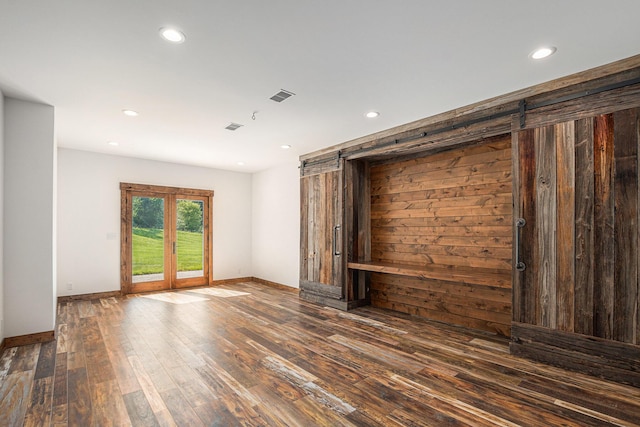 4035 136th Ave, Hamilton, MI 49419 - spare room featuring wood-type flooring, a barn door, recessed lighting, and baseboards