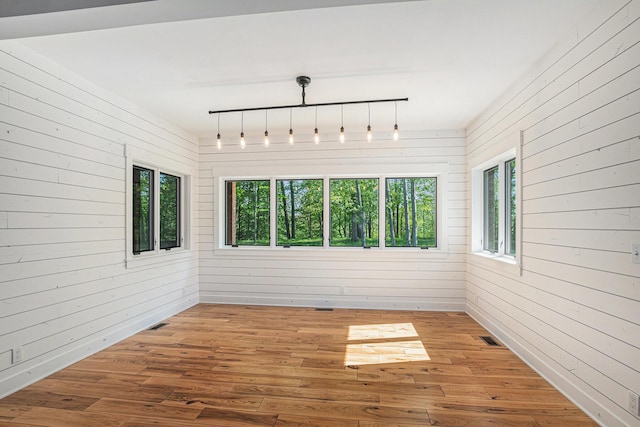 4035 136th Ave, Hamilton, MI 49419 - unfurnished sunroom featuring healthy amount of natural light and rail lighting