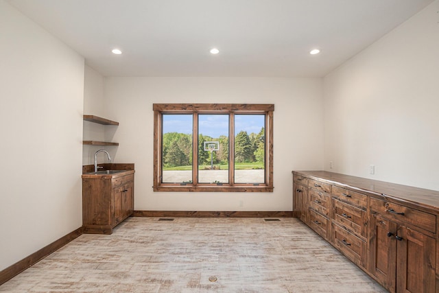 4035 136th Ave, Hamilton, MI 49419 - unfurnished dining area with a sink, recessed lighting, baseboards, and light wood-style flooring