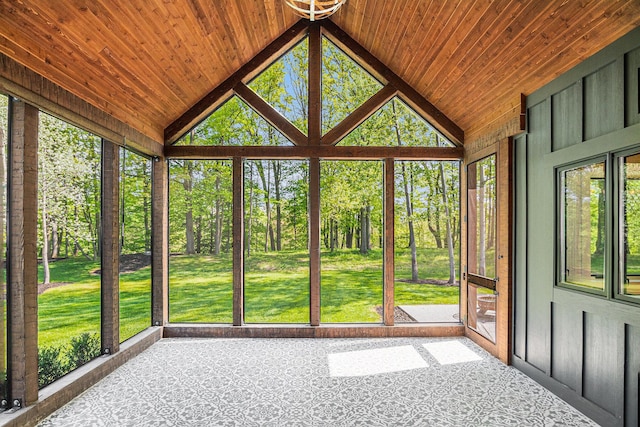 4035 136th Ave, Hamilton, MI 49419 - unfurnished sunroom with lofted ceiling, plenty of natural light, and view of wooded area