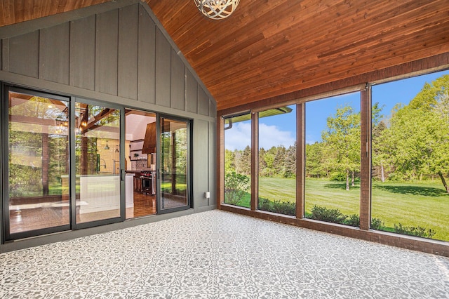 4035 136th Ave, Hamilton, MI 49419 - unfurnished sunroom featuring healthy amount of natural light, wooden ceiling, wooden walls, high vaulted ceiling, and carpet flooring