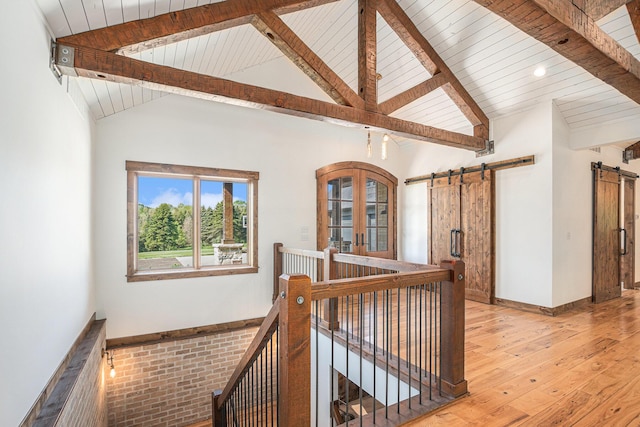 4035 136th Ave, Hamilton, MI 49419 - staircase with a barn door, hardwood / wood-style floors, wooden ceiling, and french doors