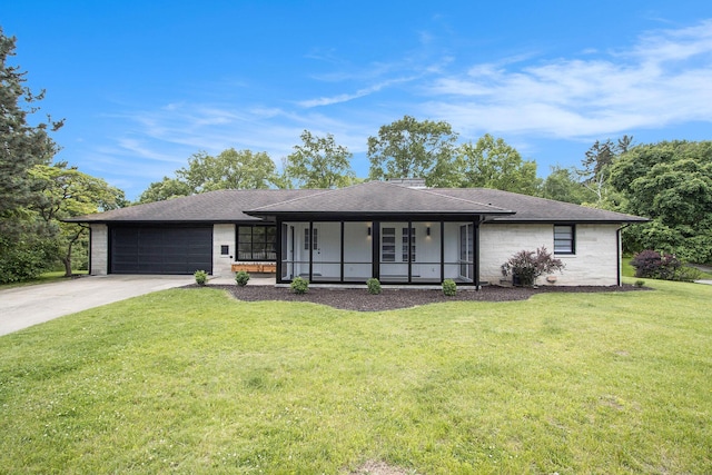 906 Wilshire Blvd, Kalamazoo, MI 49008 - view of front of home featuring an attached garage, concrete driveway, a front yard, a shingled roof, and stone siding