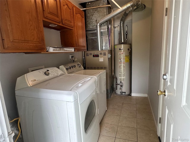 23767 Battelle Ave, Royal Oak, MI 48030 - laundry room featuring water heater, independent washer and dryer, cabinet space, light tile patterned floors, and baseboards