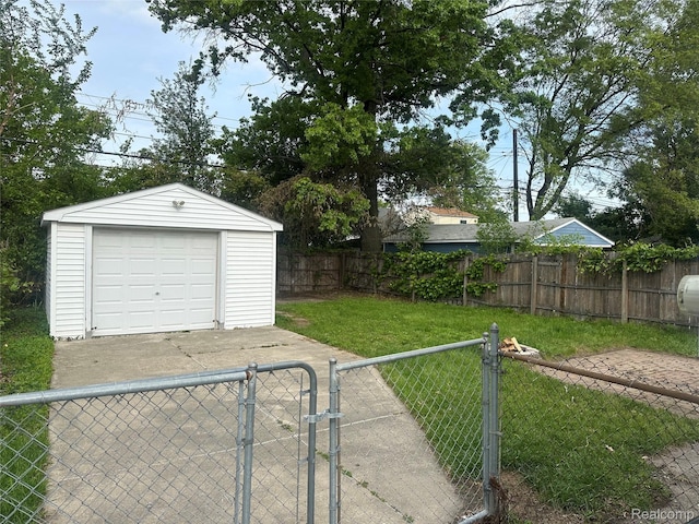 23767 Battelle Ave, Royal Oak, MI 48030 - view of yard featuring a gate, a garage, an outdoor structure, and driveway