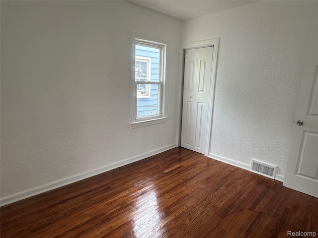 23767 Battelle Ave, Royal Oak, MI 48030 - empty room with dark wood-style flooring and baseboards