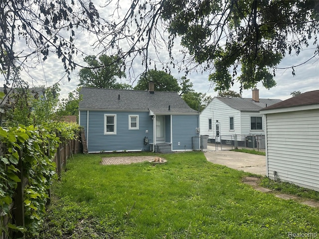 23767 Battelle Ave, Royal Oak, MI 48030 - back of property with a patio and a chimney