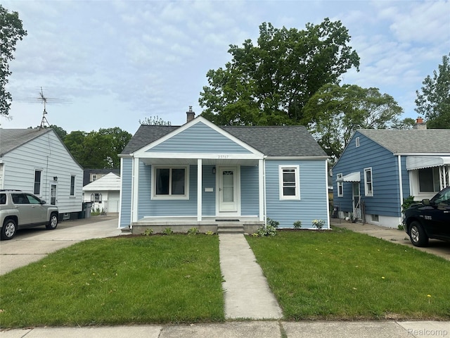 23767 Battelle Ave, Royal Oak, MI 48030 - bungalow-style house featuring covered porch, a front lawn, a shingled roof, and a chimney