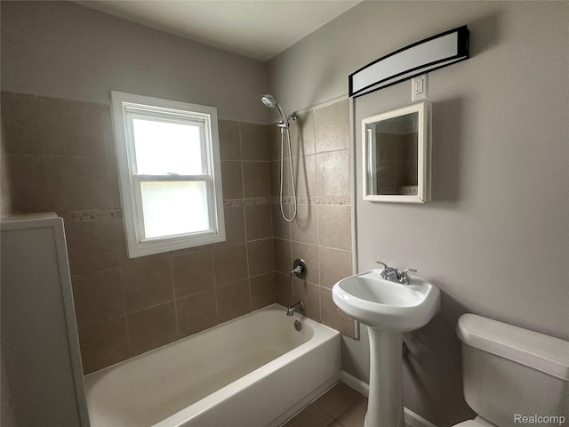 23767 Battelle Ave, Royal Oak, MI 48030 - bathroom featuring toilet, shower / washtub combination, and tile patterned flooring