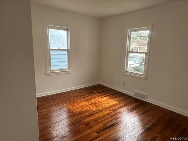 23767 Battelle Ave, Royal Oak, MI 48030 - spare room featuring dark wood finished floors and baseboards