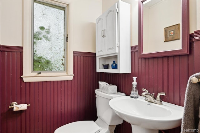 1220 Minglewood Way, Ann Arbor, MI 48103 - half bathroom with a wainscoted wall, toilet, and a sink