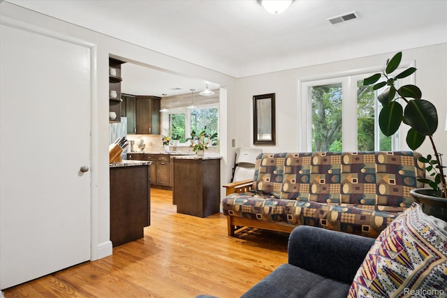 1220 Minglewood Way, Ann Arbor, MI 48103 - living area featuring light wood-type flooring and healthy amount of natural light