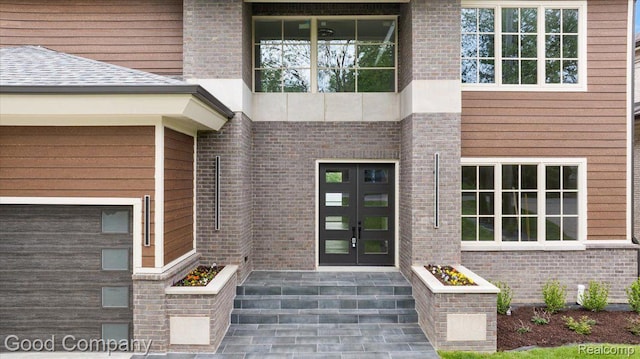 1760 Hamilton Dr, Bloomfield Hills, MI 48302 - view of exterior entry featuring french doors and brick siding
