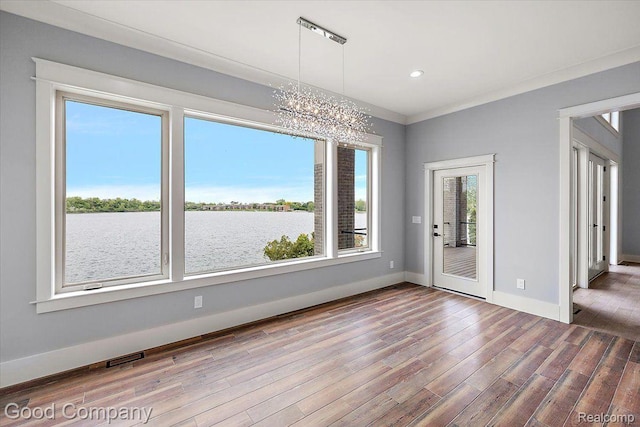 1760 Hamilton Dr, Bloomfield Hills, MI 48302 - unfurnished dining area with a chandelier, wood finished floors, baseboards, recessed lighting, and a water view