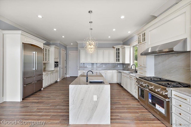 1760 Hamilton Dr, Bloomfield Hills, MI 48302 - kitchen with a sink, high quality appliances, wall chimney exhaust hood, ornamental molding, and a center island with sink