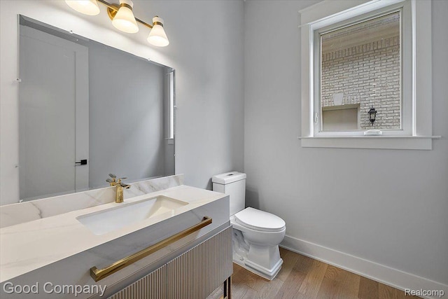1760 Hamilton Dr, Bloomfield Hills, MI 48302 - half bath with wood finished floors, toilet, baseboards, and vanity