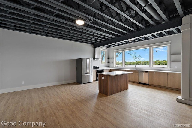 1760 Hamilton Dr, Bloomfield Hills, MI 48302 - kitchen with appliances with stainless steel finishes, a center island, and light wood finished floors