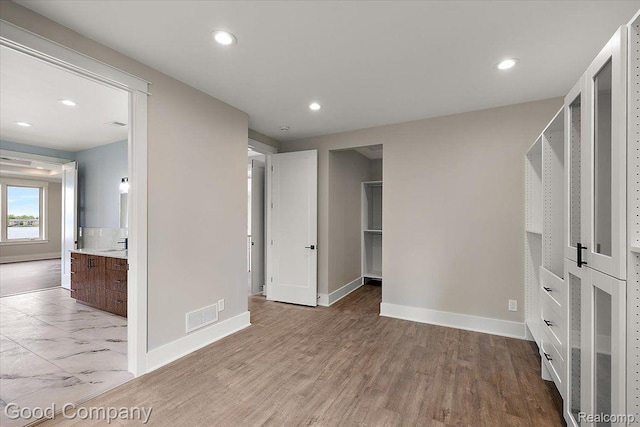 1760 Hamilton Dr, Bloomfield Hills, MI 48302 - unfurnished bedroom with baseboards, recessed lighting, light wood finished floors, and a sink